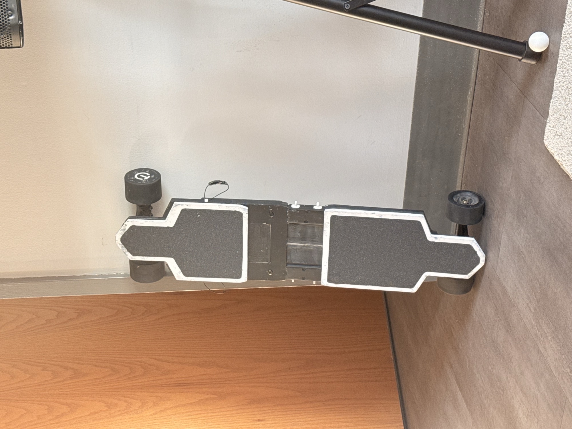 Zephyr board, folded, propped against a stair railing