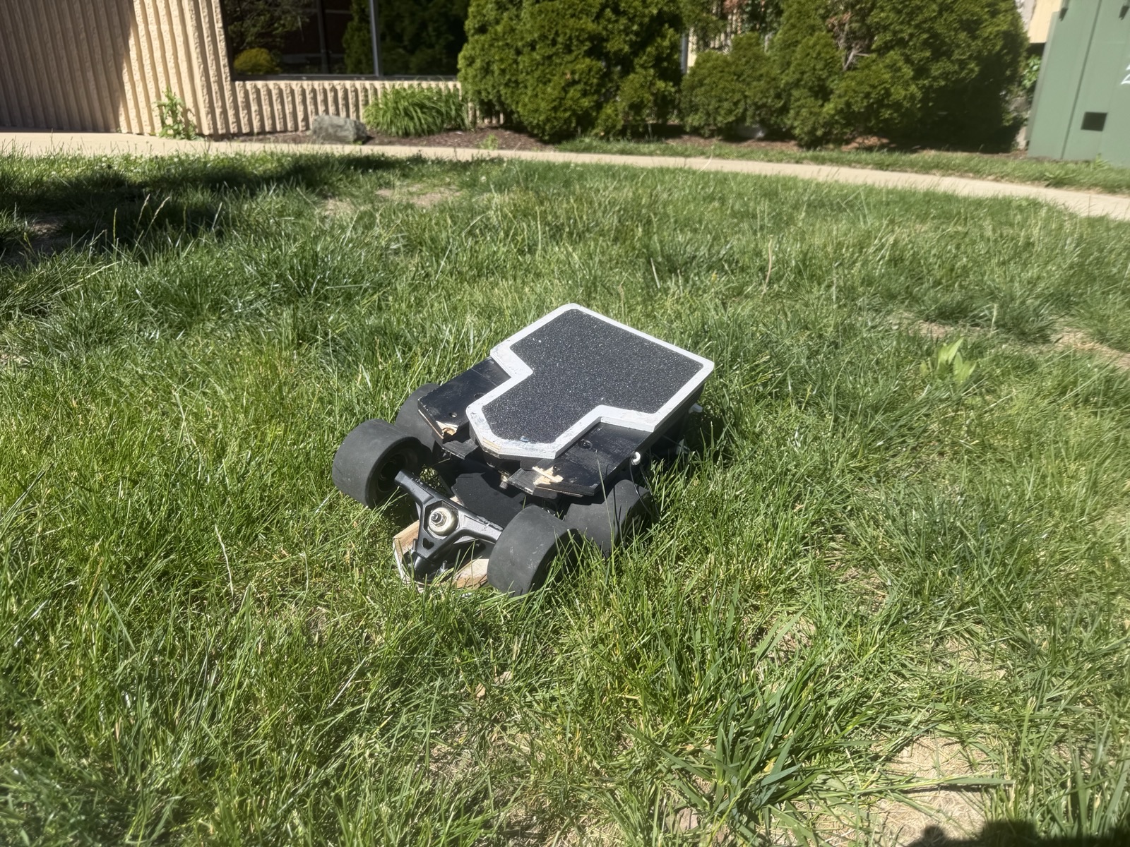 Zephyr board, folded, resting on grass